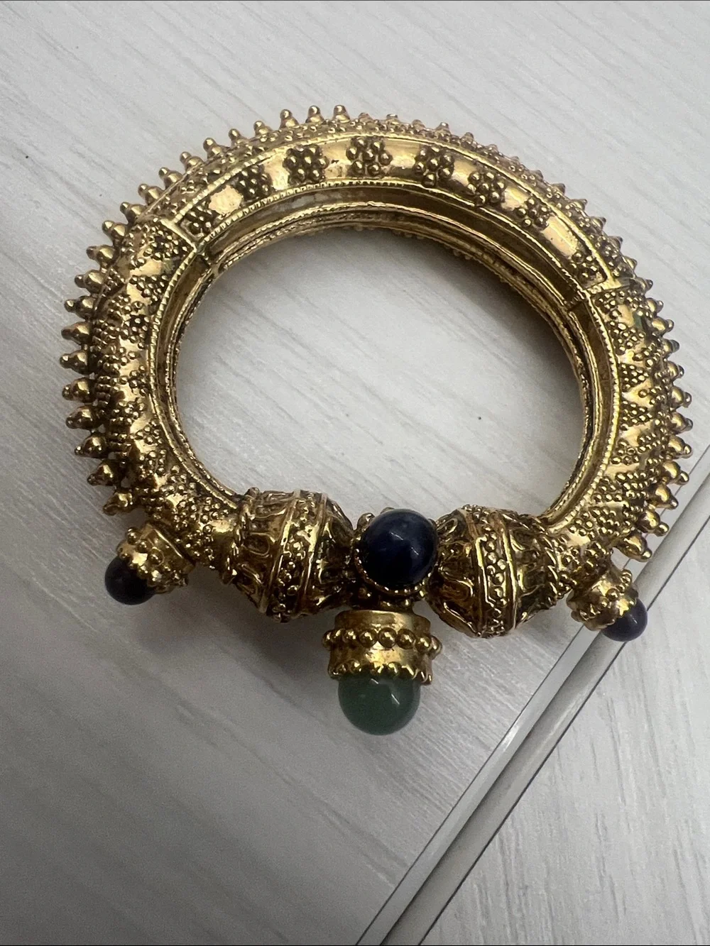 Gold-Tone Textured Hinged Bangle with Blue & Green Cabochons